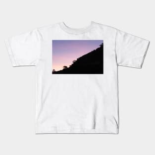 Contrasting scene of silhouette slope of Mount Maunganui Kids T-Shirt